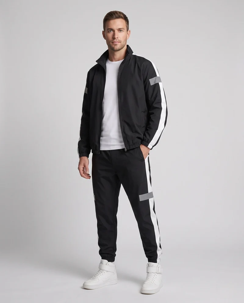 Herren leichter sportlicher Trainingsanzug mit Windbreaker, reflektierenden Einsätzen und schmal zulaufenden Jogginghosen