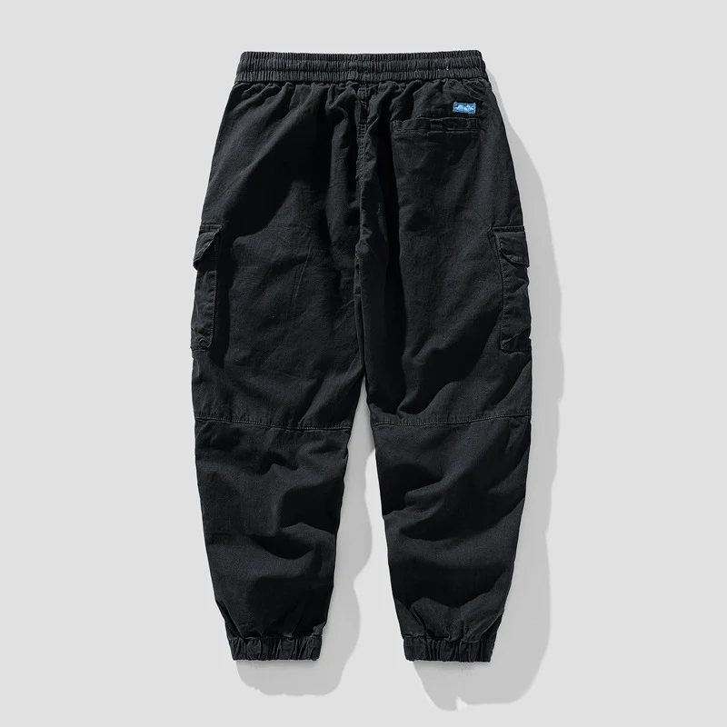 Herren Leichte Canvas-Cargohose im Joggerstil mit elastischem Bund, segmentierten Kniepaneelen und verdeckten Klappentaschen Drune