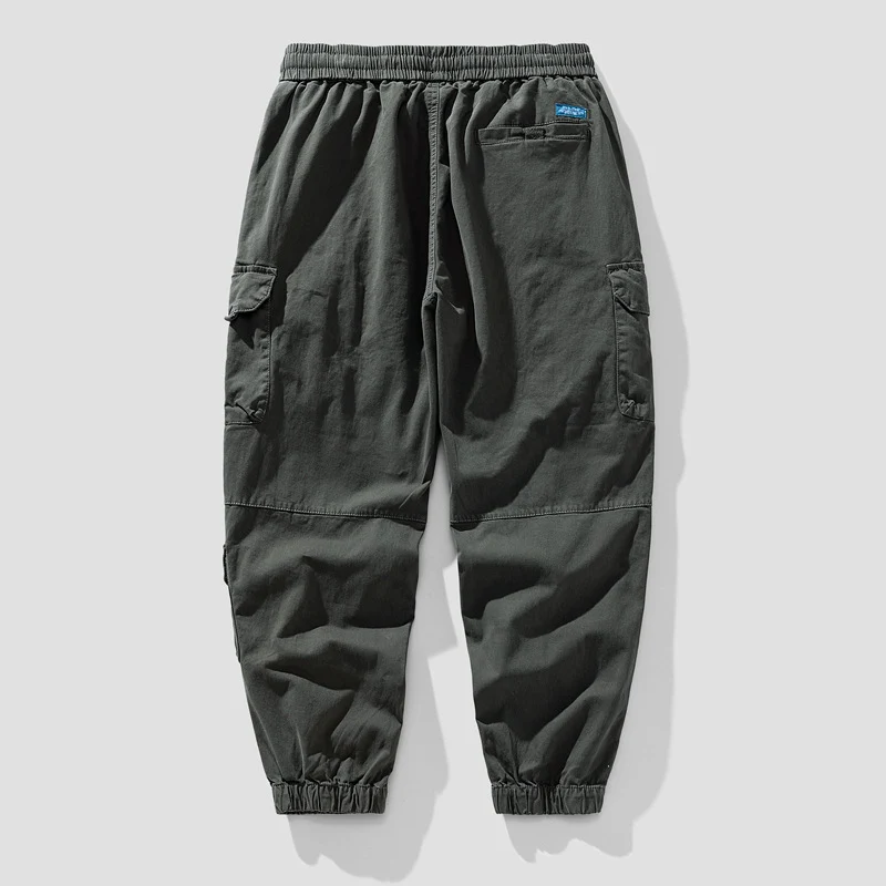 Herren Leichte Canvas-Cargohose im Joggerstil mit elastischem Bund, segmentierten Kniepaneelen und verdeckten Klappentaschen Drune