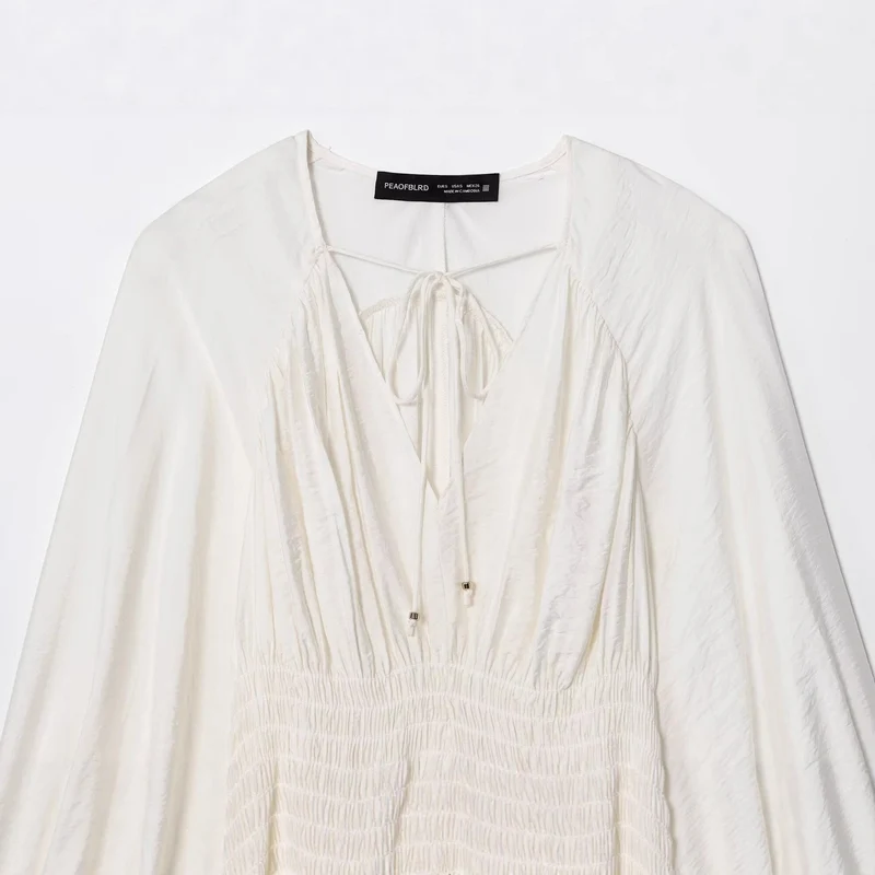 Damen Boho-Bluse mit Smock-Taillenbund, V-Ausschnitt und Ballonärmeln Drune