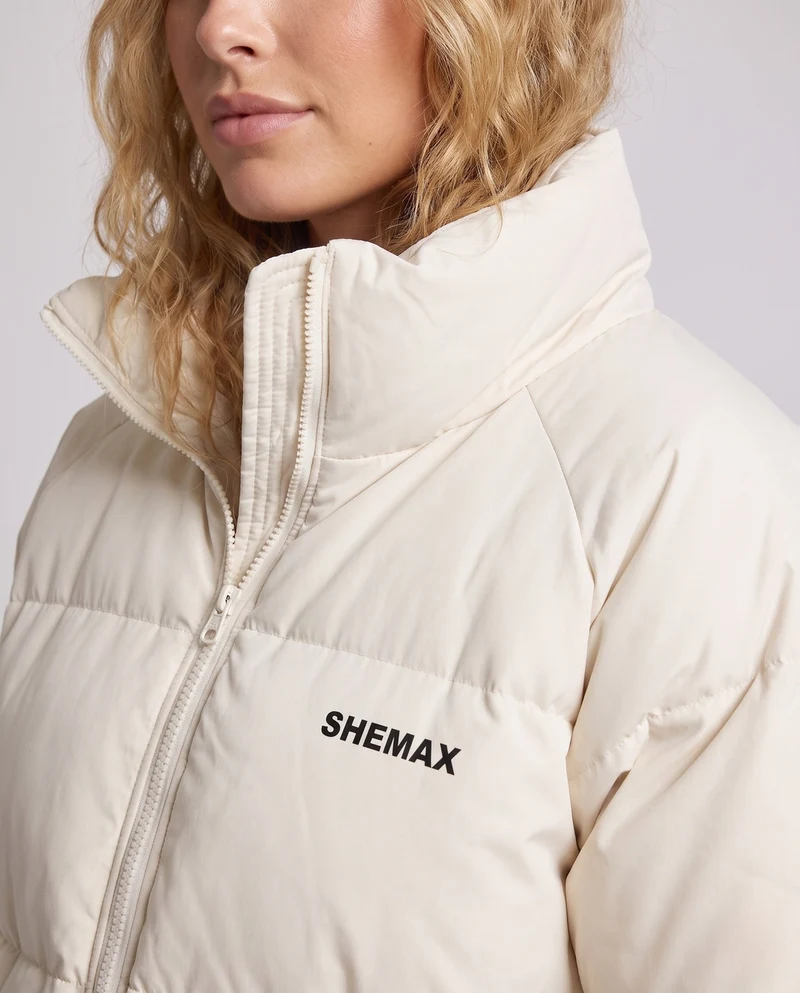 Damen ungefütterte boxy Pufferjacke mit hohem Stehkragen, Raglanärmeln und sauberem Logo