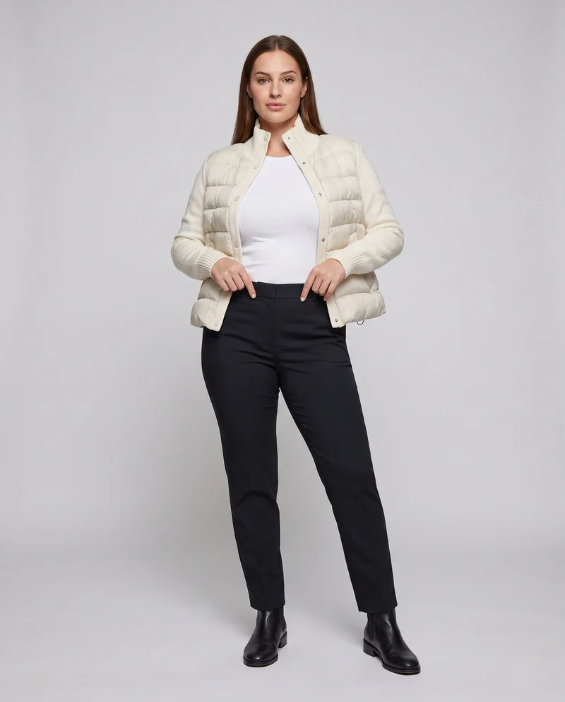Damen kurze Stepp-Hybridjacke mit weichen Strickärmeln, Stehkragen und Druckknopfverschluss