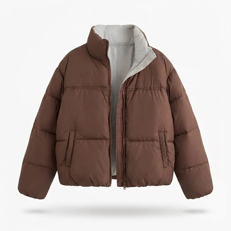 Damen kurze gepolsterte boxy Pufferjacke mit zweilagigem Stehkragen und verdecktem Reißverschluss.