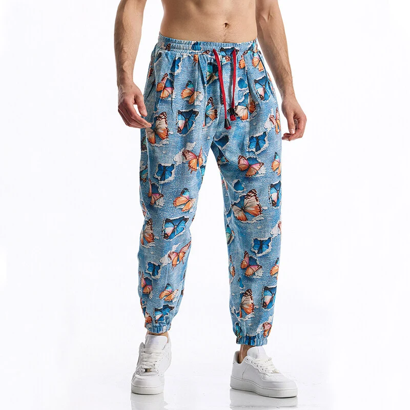Herren Gemusterte Jogginghose im tapered Schnitt mit elastischem Bund und Tunnelzug Drune