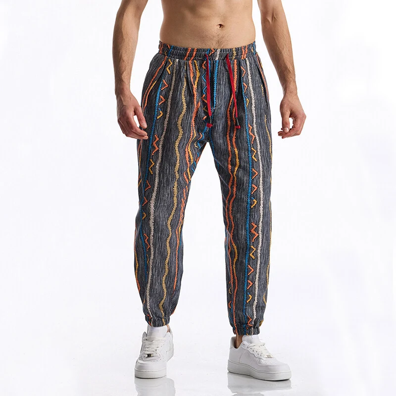 Herren Gemusterte Jogginghose im tapered Schnitt mit elastischem Bund und Tunnelzug Drune