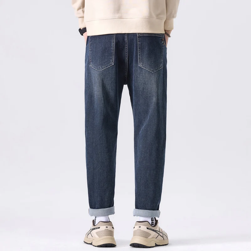 Herren Tapered-Denimhose mit mittelhohem Bund, gekrempeltem Saum und dezenter Used-Waschung Drune