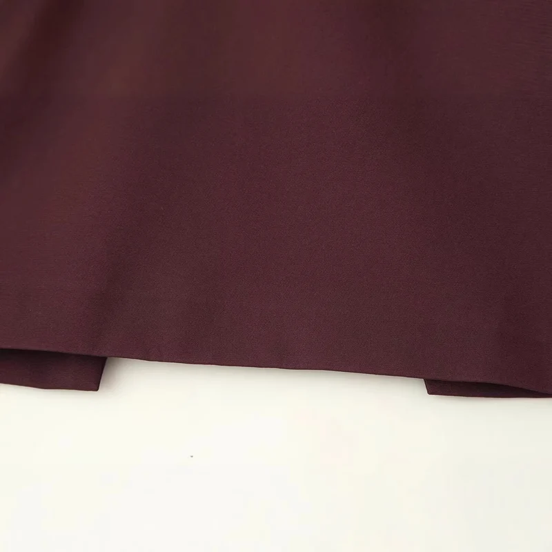 Damen Top mit Capelet-Überwurf und taillierter Peplum‑Silhouette Drune
