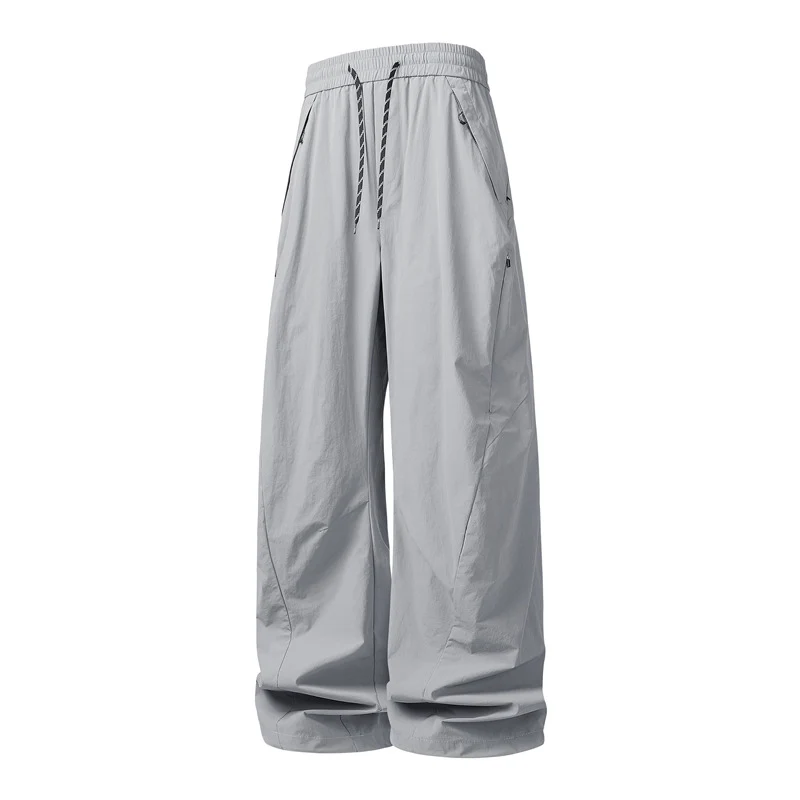Unisex Weite Tech-Baggy-Hose mit elastischem Kordbund, Reißverschlusstaschen & wasserabweisender Nylonoptik Drune