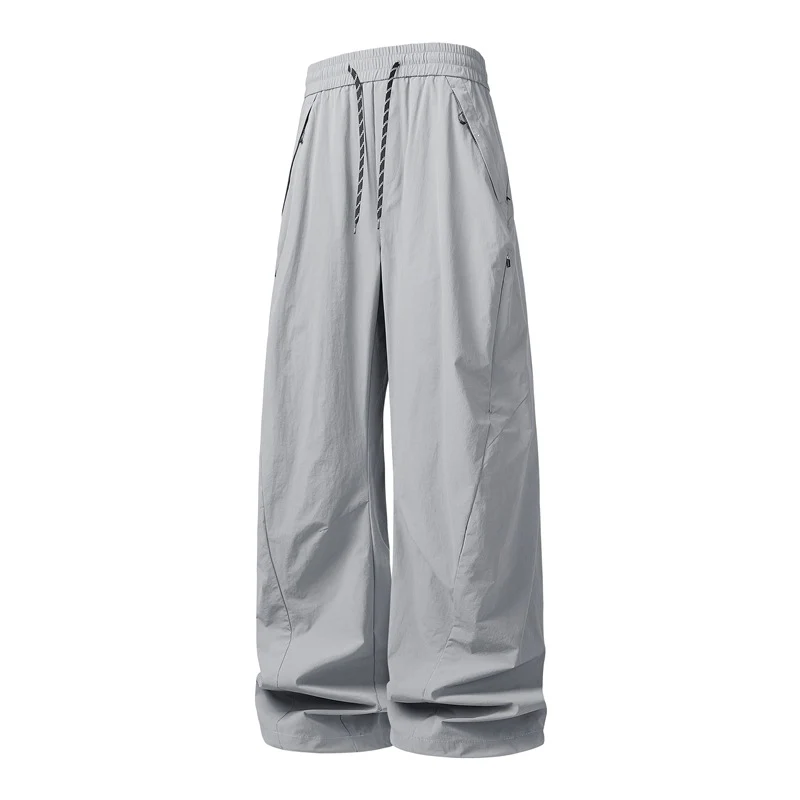 Unisex Weite Tech-Baggy-Hose mit elastischem Kordbund, Reißverschlusstaschen & wasserabweisender Nylonoptik Drune