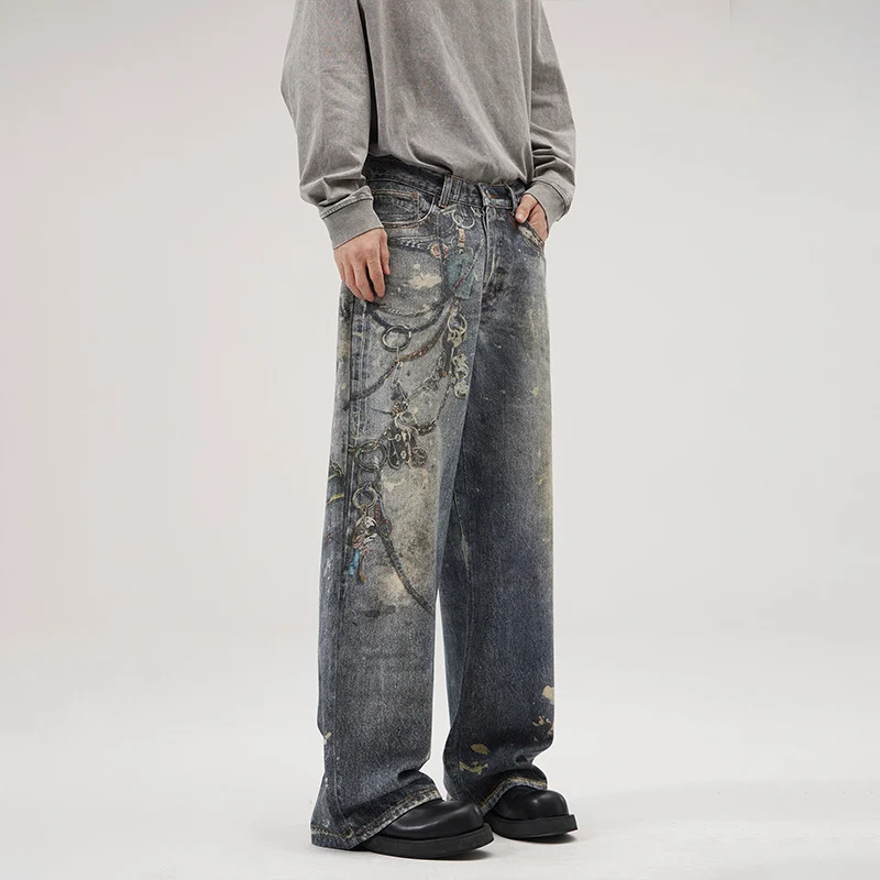 Herren Weit geschnittene Stonewashed-Denim-Jeans mit Kettenprint, Farb‑Splatter und bodenlangem Saum Drune