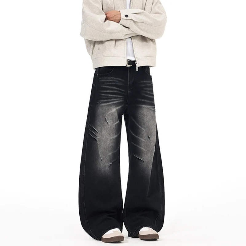 Herren Ultraweite Denim-Palazzohose mit skulpturalen Seitenbahnen und Used‑Effekt Drune