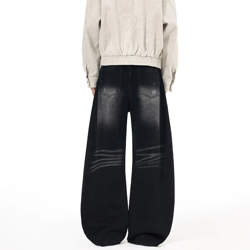 Herren Ultraweite Denim-Palazzohose mit skulpturalen Seitenbahnen und Used‑Effekt Drune