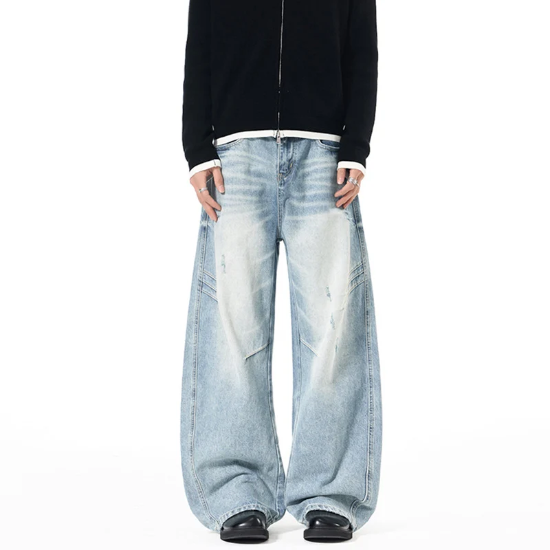 Herren Ultraweite Denim-Palazzohose mit skulpturalen Seitenbahnen und Used‑Effekt Drune