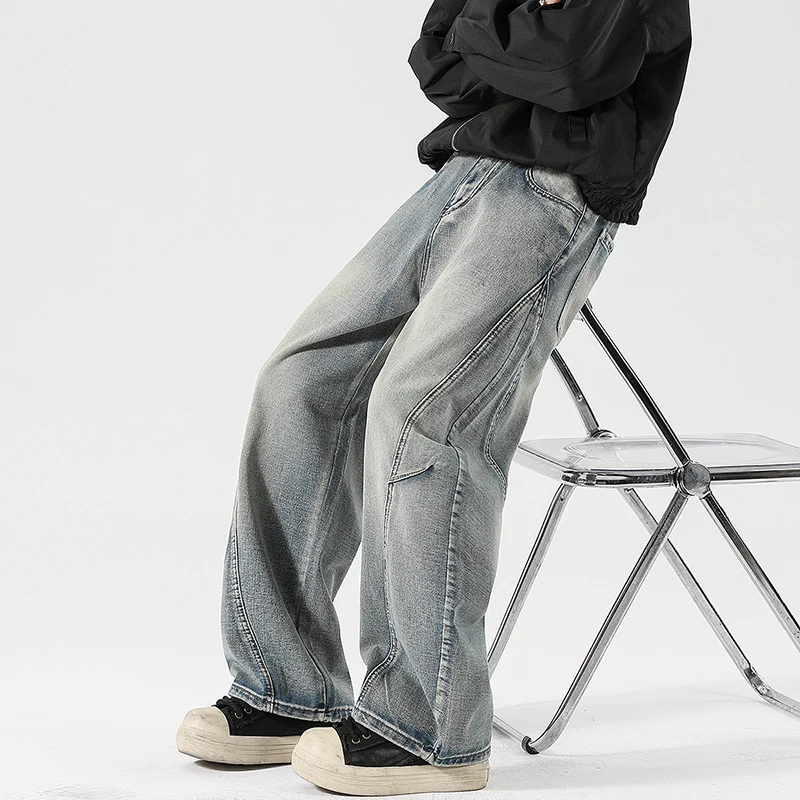 Herren Weite Stonewashed-Paneel-Denimhose mit tiefem Schritt und markanten Ziernähten Drune